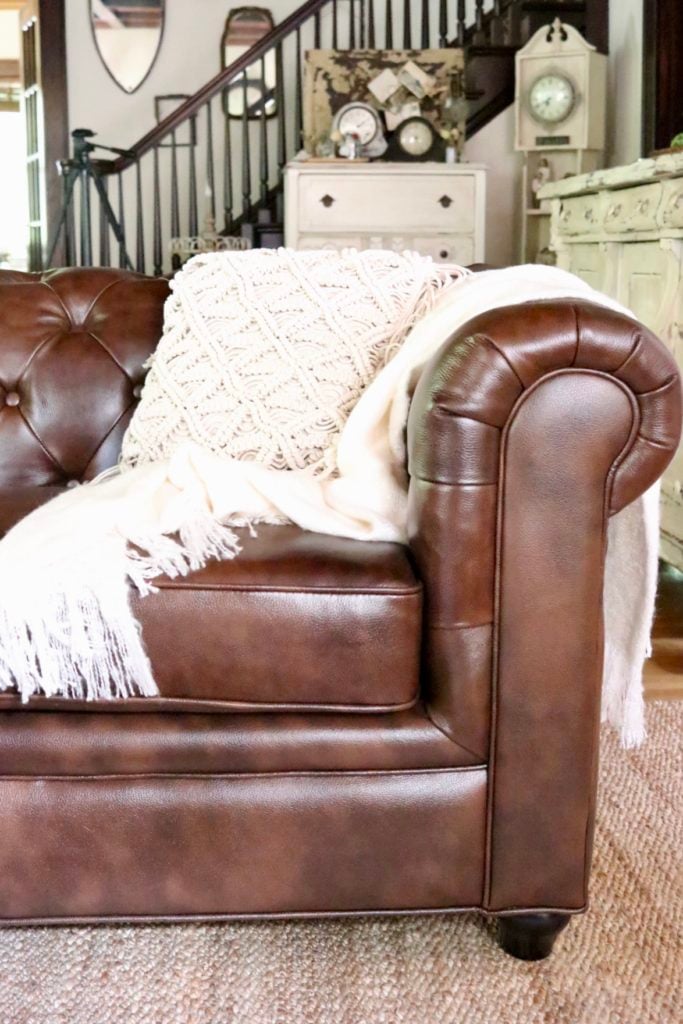 Beautiful Leather Chesterfield sofa macrame boho throw pillow neutral decor jute area rug from Soft Surroundings